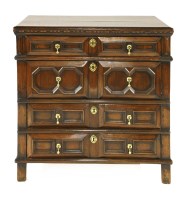 Lot 595 - An oak chest of four long drawers