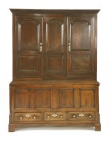 Lot 576 - A George III oak hanging cupboard