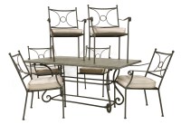 Lot 602 - A modern wrought iron garden table and six chairs