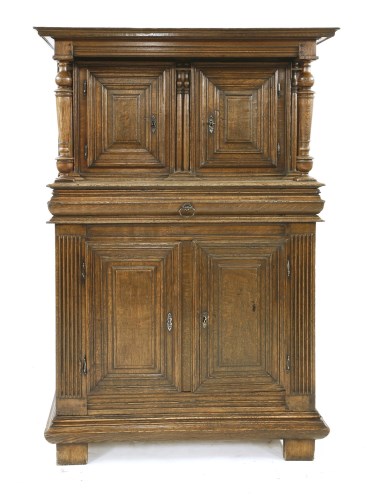 Lot 584 - A Continental oak cupboard