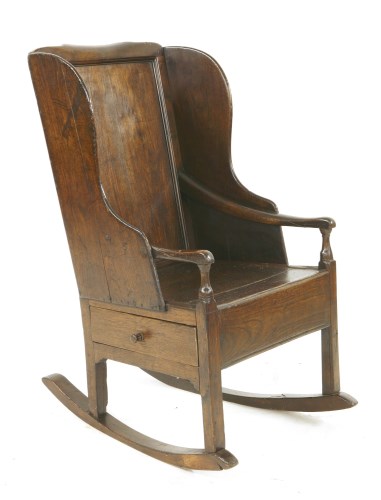 Lot 533 - An oak rocking chair