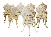 Lot 905 - A set of eight Coalbrookdale-style white painted cast iron garden chairs