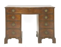 Lot 885 - A George III mahogany serpentine dressing chest