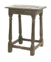 Lot 839 - An oak joined stool