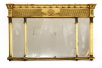 Lot 574 - A gilt overmantel mirror in the style of Thomas Hope