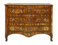 Lot 506 - A North European olivewood serpentine commode chest