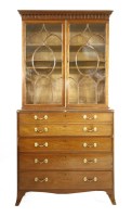 Lot 977 - A George III Sheraton design mahogany secretaire bookcase