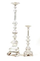 Lot 487 - A large silvered wooden candle stand of turned faceted form