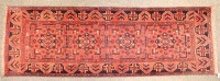 Lot 590 - A red ground rug