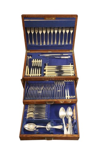 Lot 65 - An early 20th century Walker and Hall oak cased canteen of cutlery