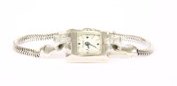 Lot 181 - A ladies' white gold diamond set Bulova mechanical cocktail watch