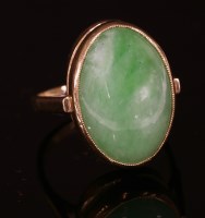 Lot 128 - A 9ct gold single stone jade ring