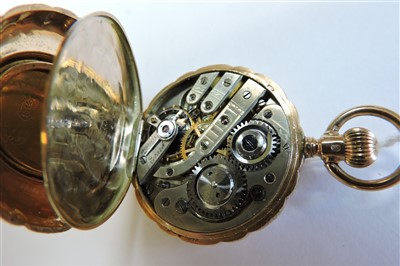 Lot 584 - A Swiss gold, side wind, diamond and enamel Hunter fob watch