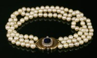 Lot 320 - A three row uniform cultured pearl necklace