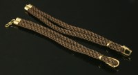 Lot 666 - A pair of brown silk cord bracelets