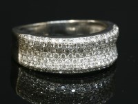 Lot 569 - An 18ct white gold pavé set diamond half hoop ring