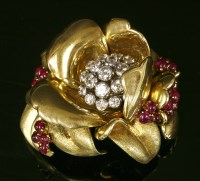 Lot 212 - A gold diamond and ruby set brooch