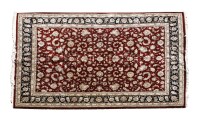 Lot 423A - A large modern Indian wine ground carpet