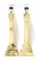 Lot 280 - A pair of alabaster table lamps