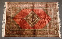 Lot 450 - A hand knotted Persian silk and woollen rug