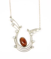 Lot 75 - A silver amber and moonstone cabochon stylised centrepiece