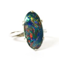 Lot 60 - A single stone black opal triplet ring
