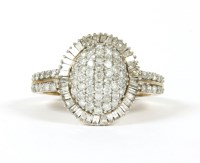 Lot 89 - A gold diamond dome shaped head cluster ring