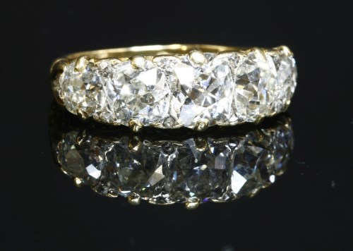 Lot 39 - A Victorian five stone carved head diamond ring