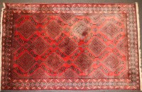 Lot 753 - A large red ground rug