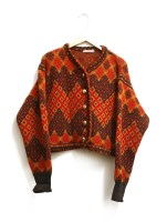 Lot 454 - A collection of vintage designer clothes to include a vintage Yves Saint Laurent Aztec wool cardigan in red