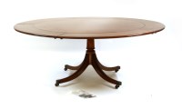 Lot 422 - A Jupe style mahogany dining table