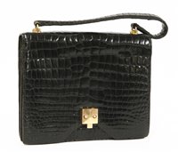Lot 687 - An Hermes vintage black crocodile skin handbag