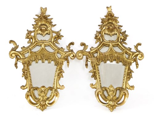 Lot 829 - A pair of carved and gilt multiglass wall lights