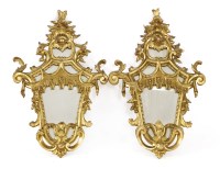 Lot 829 - A pair of carved and gilt multiglass wall lights