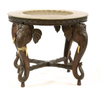 Lot 767 - An Indian carved hardwood centre table