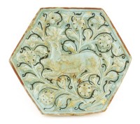 Lot 159 - A rare moulded pottery tile