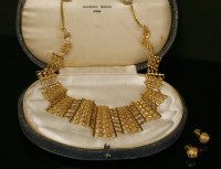 Lot 269 - A high carat gold articulated bib style necklace and a pair of matched earrings