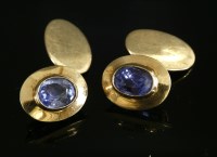 Lot 200 - A pair of gold single stone sapphire cufflinks