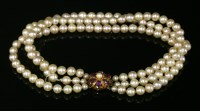 Lot 678 - A three row uniform cultured pearl choker