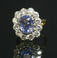 Lot 287 - A sapphire and diamond oval cluster ring