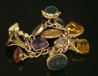Lot 655 - A 9ct gold curb link charm bracelet