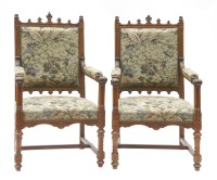 Lot 907 - A pair of Gothic walnut elbow chairs