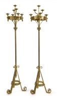 Lot 968 - A pair of Victorian Gothic brass candelabra