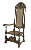 Lot 866 - A fruitwood high back elbow chair