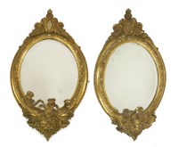 Lot 1005 - A pair of giltwood and composition girandoles