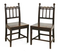 Lot 865 - A pair of carved oak side chairs