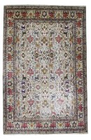 Lot 923 - A large cream ground Tabriz carpet
