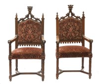 Lot 597 - A pair of Gothic walnut elbow chairs