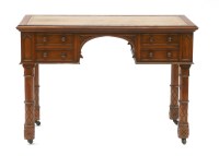 Lot 688 - A satin walnut kneehole writing table