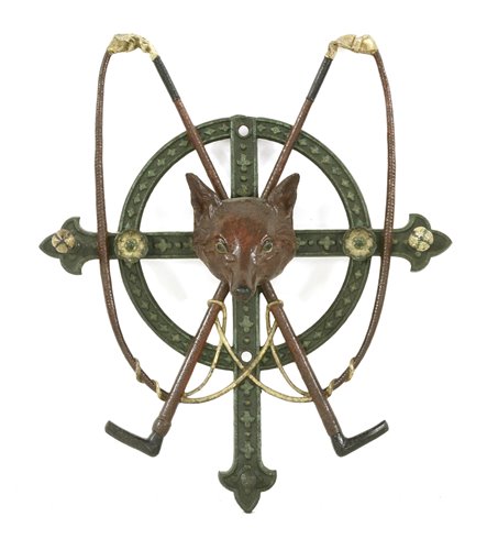 Lot 19 - A cast iron wall hanging whip stand